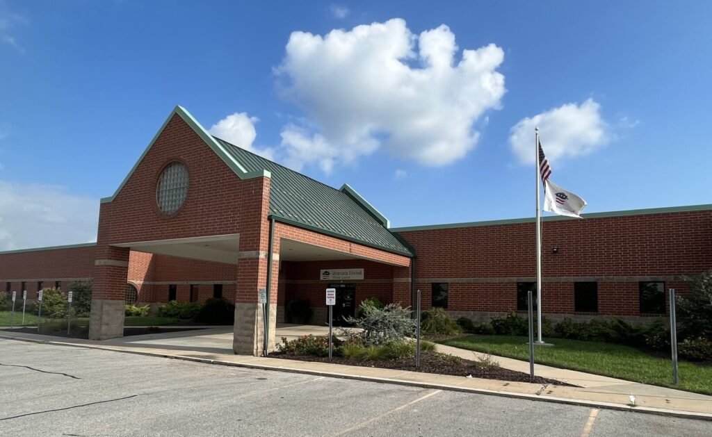 Front entrance of brick building with Veterans United Home Loans on front of building