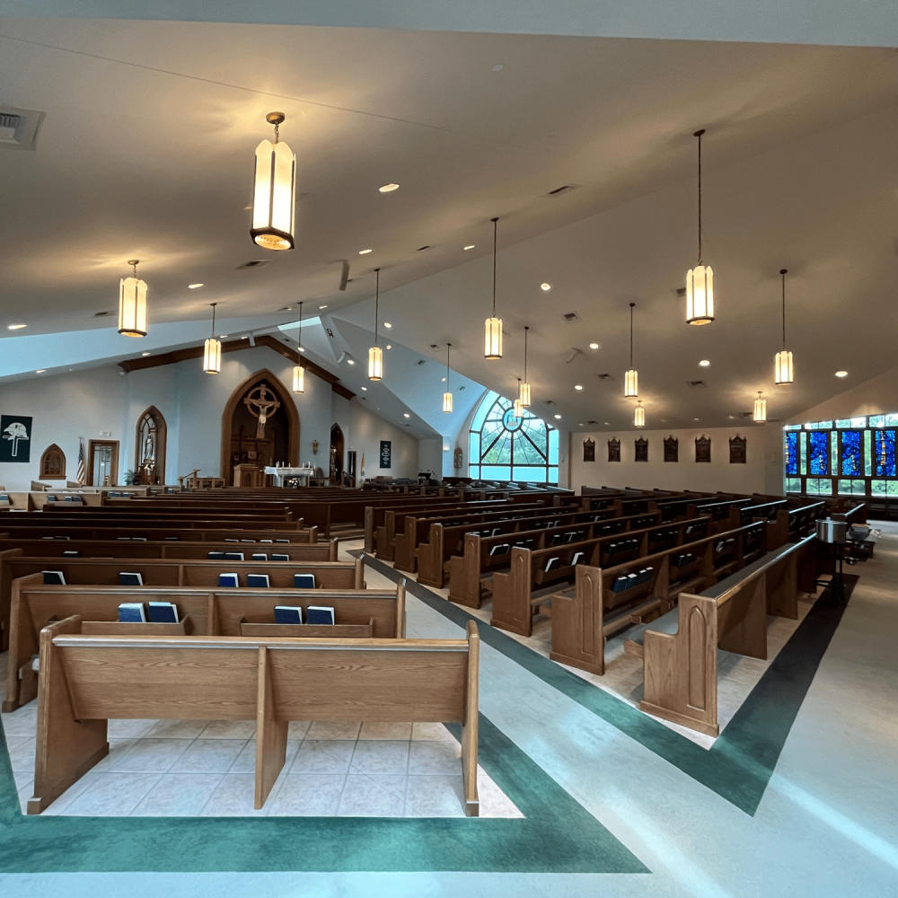 Expansive inside view of St. Andrew Catholic Church from back corner