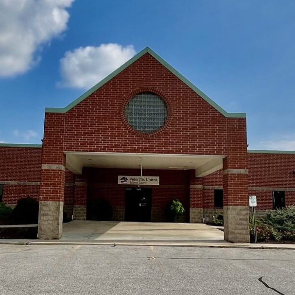 Front entrance of brick building with Veterans United Home Loans on front of building